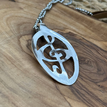 Hand cut Silver Treble Clef Pendant