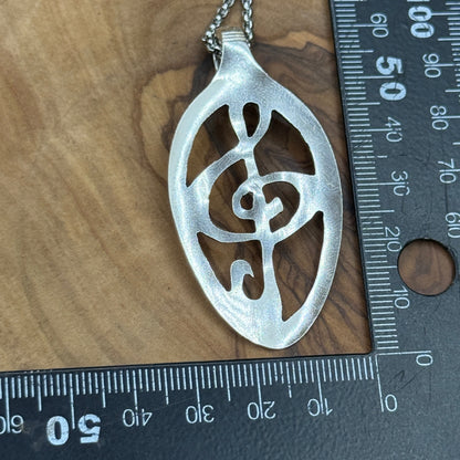 Hand cut Silver Treble Clef Pendant
