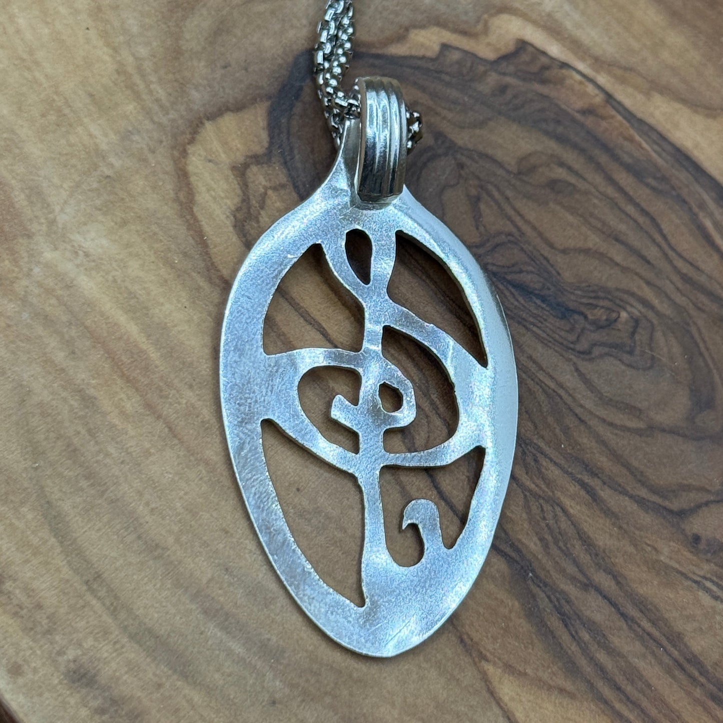 Hand cut Silver Treble Clef Pendant