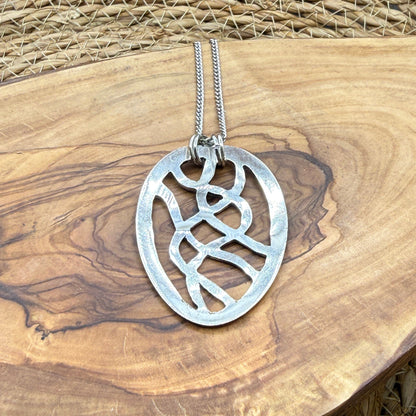 Hand cut Silver Abstract Pendant