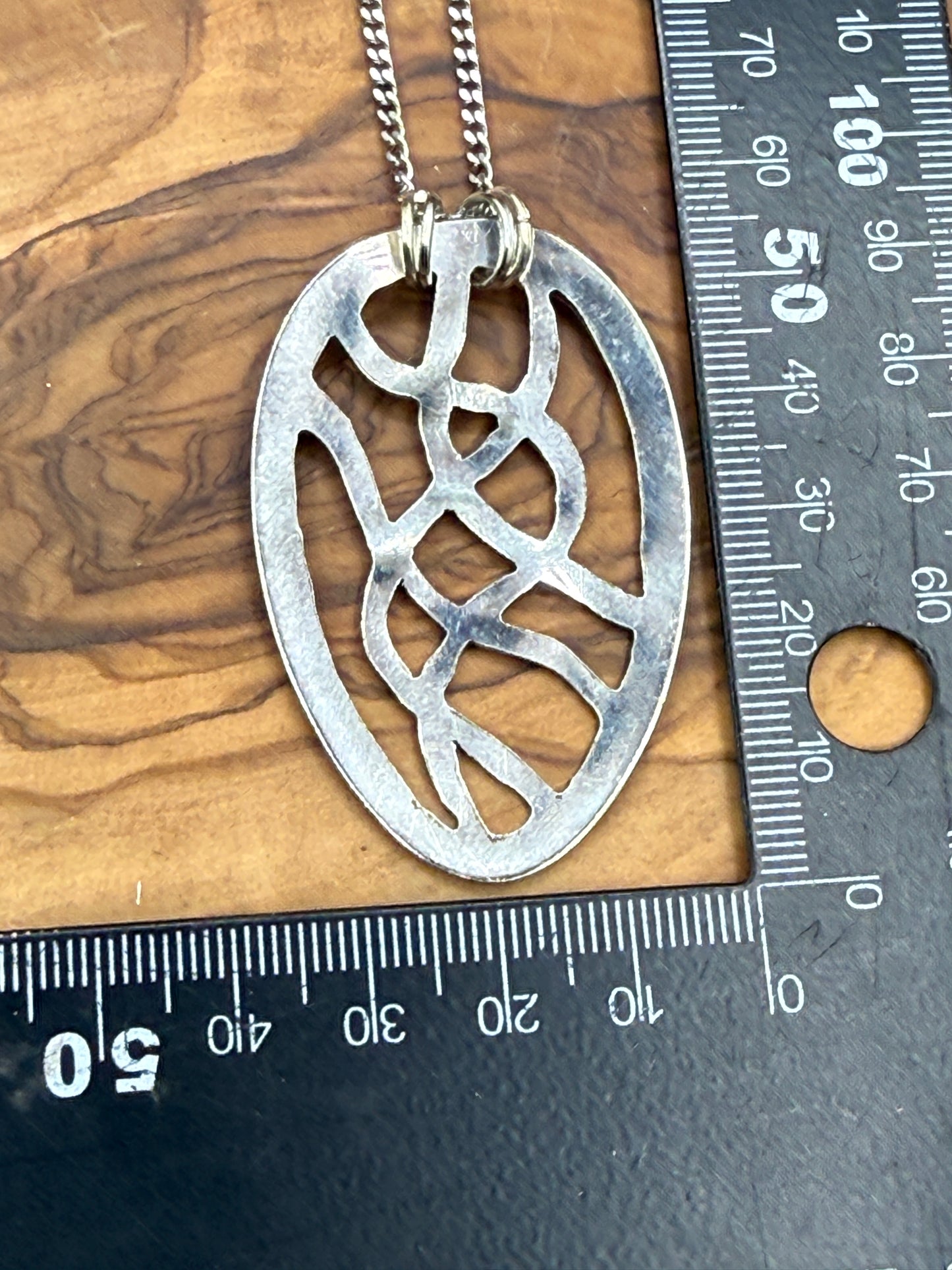 Hand cut Silver Abstract Pendant