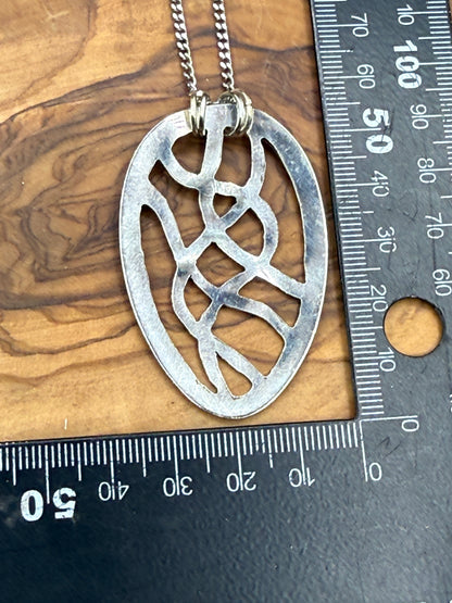 Hand cut Silver Abstract Pendant