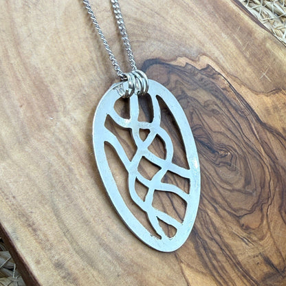 Hand cut Silver Abstract Pendant