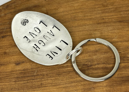 Custom Handcrafted Spoon Keychain with the Quote “Live, Laugh, Love”.  Perfect handmade birthday or graduation gift.